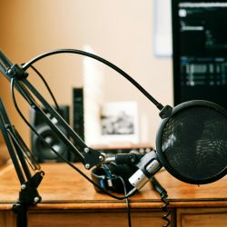 Photo by ConvertKit (Soon to be KIt) black headphones on brown wooden table